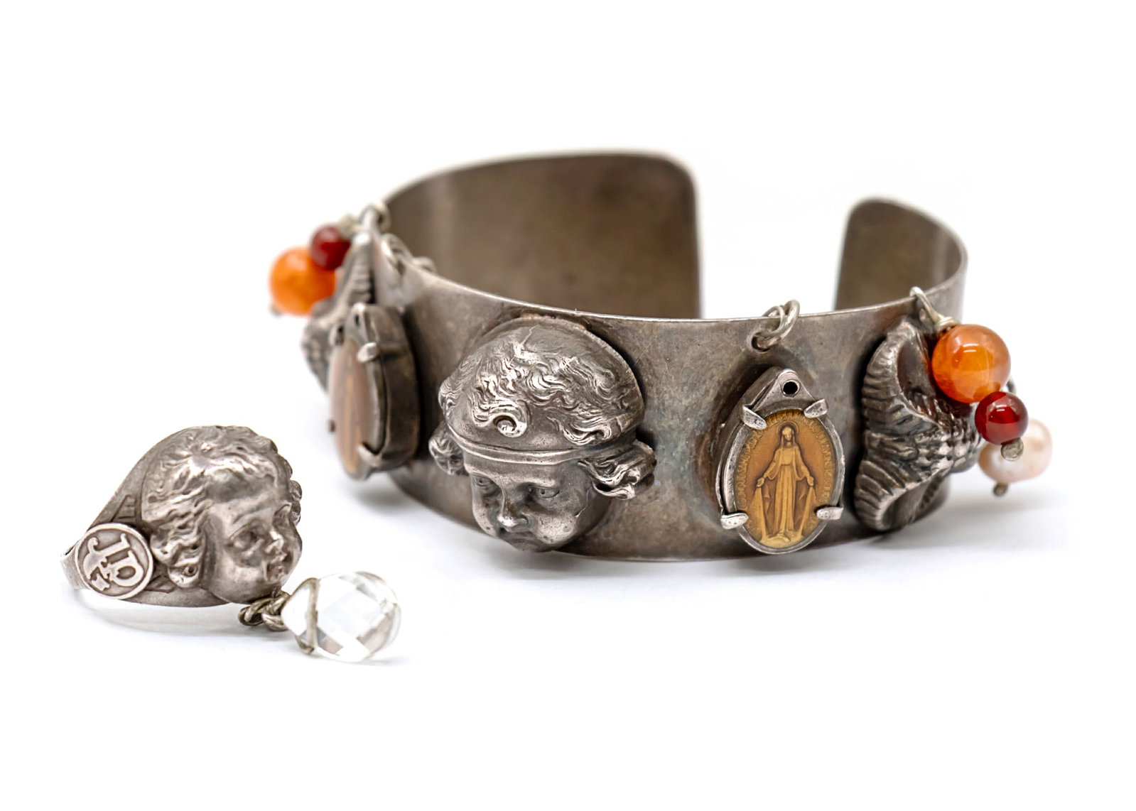 Jean Paul Gaultier - Rare Silver Bracelet and Ring.: Jean Paul Gaultier - Rare Silver Bracelet and Ring. From Jean Paul Gaultier - Les Tatouages collection of Spring 1994 that echoed across the world of fashion and art. The bracelet is centered with a