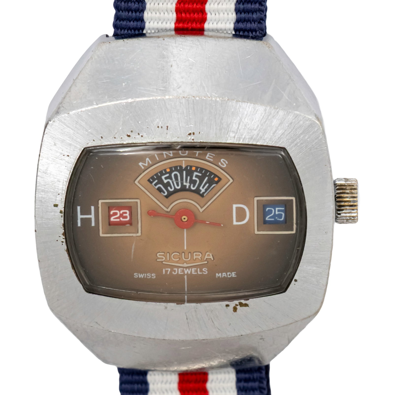 Sicura Jump Hour Wristwatch, 70's.: Sicura Jump Hour Wristwatch, 70's. Mechanical movement, working condition. Date. Nato strap. 43x36mm.