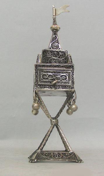 Sterling Silver Filigree Spice Box Besamim, Judaica.: Israel, 1950s, Jewish. Set on a square base raised by four crossing poles, the spice compartment is made with a hinged door to allow insertion of the spices. Conical upper part topped with a pennant. 