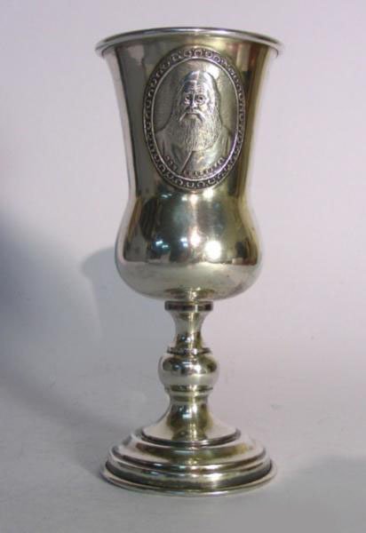 Sterling Silver Don Abarbanel Wine Kiddush Cup, Judaica: Europe, 1930s. The cup is applied with an oval portrait of Don Isaac Ben Judah Abarbanel. Engraved with monogrammed initials and dated 1952. Gilt interior. Marked - Sterling. Height: 14cm / 5.5in. Wei