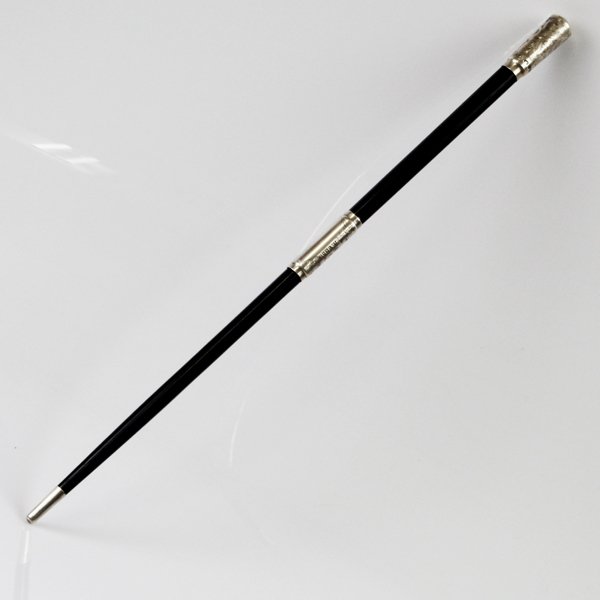 Sterling Silver Mounted Ebony Wood Conductor's Baton.: Sterling Silver Mounted Ebony Wood Travelling Conductor's Baton, London, England, 1923. Tapering form, the silver mounts are engraved with foliate ornaments. Vacant cartouche. Screw-apart center. Mark