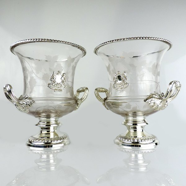 Silver Plated & Glass Champagne Wine Coolers NY Ca 1930: Pair Of Silver Plated & Glass Champagne Wine Coolers, E.G. Webster, NY, Ca 1930. Each set on a circular base with gadroon borders, the glass body is etched with vine leaves and applied with an armoria