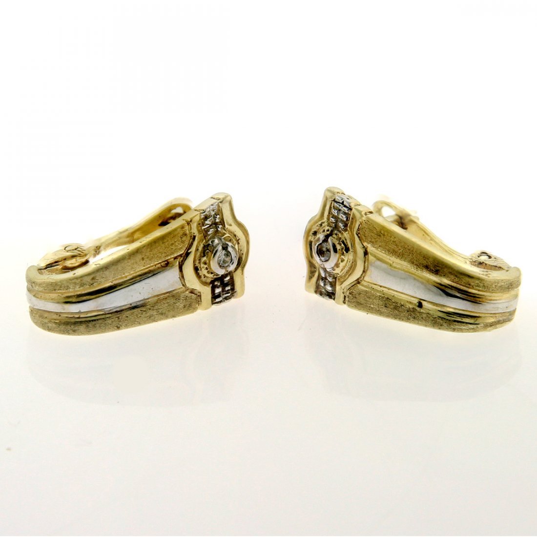Pair of 14k Yellow and White Gold Diamond Earrings.: Pair of 14k Yellow and White Gold Diamond Earrings. Set with two diamonds 0.04ctw. Marked. Snap closure. Length: 1.9cm / 0.748in. 4.18gr / 0.134oz.