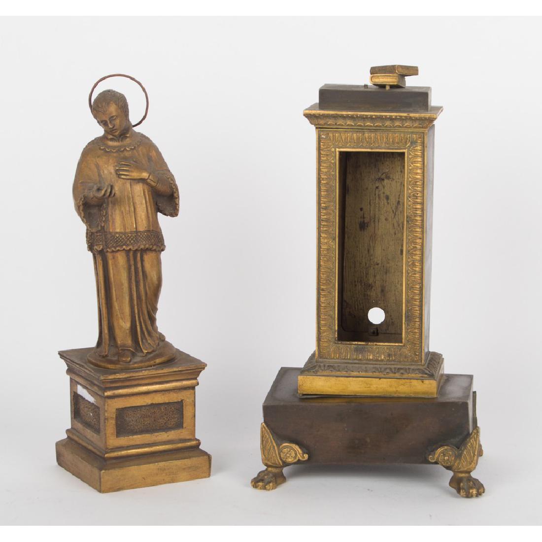 LOTTO composto da piccolo ELEMENTO Impero in bronzo e: LOTTO composto da piccolo ELEMENTO Impero in bronzo e da SCULTURA in ottone raffiguante "San Domenico". XIX secolo Misure: h cm 21 - h cm 22