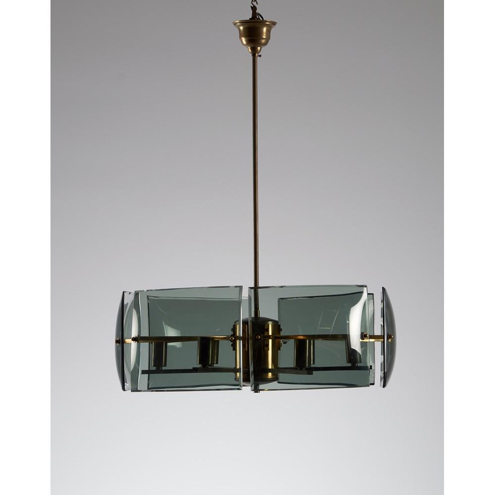 ESPERIA Produzione italiana anni '60 Lampada da: ESPERIA Produzione italiana anni '60 Lampada da soffitto circolare in ottone e vetri curvati fumè. Alt. cm 72.