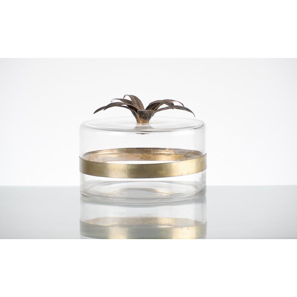 MARCELLA CRESPI (Attr.le) Scatola in vetro: MARCELLA CRESPI (Attr.le) Produzione Italiana anni â€™70 Scatola in vetro trasparente di forma circolare, fascia in metallo argentato, decoro in metallo argentato a foglie sul coperchio. Alt. cm