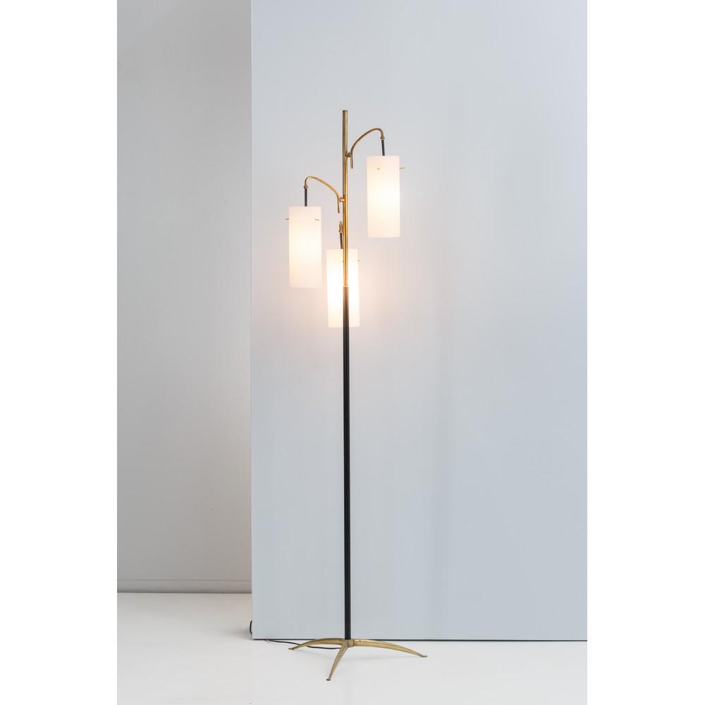ANGELO LELLI (Attr.le), Lampada da terra a tre luci: ANGELO LELLI (Attr.le) Lampada da terra a tre luci, piede tripode in ottone, stelo in metallo verniciato nero, tre brecci in ottone ricurvo da cui pendono diffusori cilindrici in vetro satinato bianco