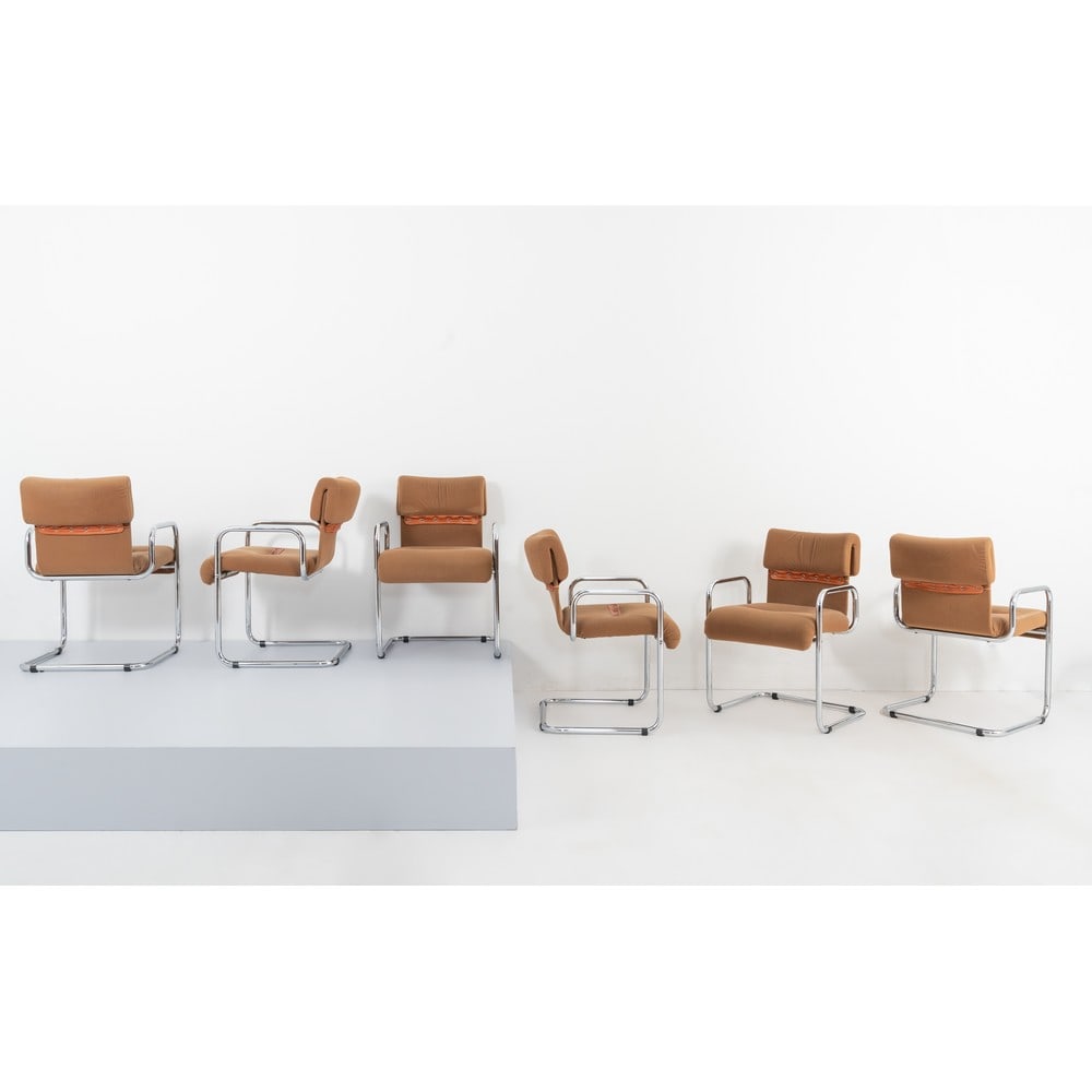 GUIDO FALESCHINI, Sei poltroncine: GUIDO FALESCHINI Produzione Mariani per Hermès, Italia 1975 ca. Sei poltroncine con struttura in metallo tubolare cromato. Spalliera e seduta con imbottitura e rivestimento in tessuto senape con