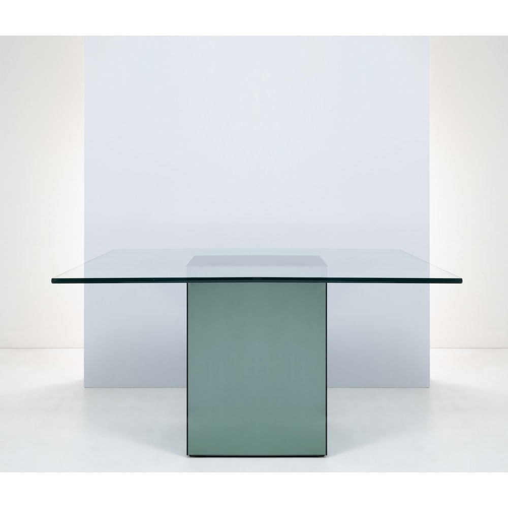 NANDA VIGO, Tavolo da pranzo modello “Block”: NANDA VIGO Produzione Acerbis, Italia 1970 ca. Tavolo da pranzo modello “Block”, piede rivestito con cristallo specchiato, piano quadrato in cristallo trasparente e specchiato. cm 140 x 14