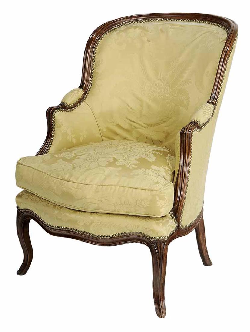 Louis XV Style Carved Beechwood and: Silk Damask-Upholstered Bergère French, late 19th century, beechwood frame with pinned construction, yellow silk damask upholstery, 37 in.. Provenance: Private Collection, Atlanta, Georgia
