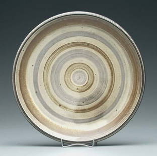 William Wyman stoneware plate: William Wyman stoneware plate (Massachusetts, 1922-1980), marked on base "Wyman 55", 12 in.