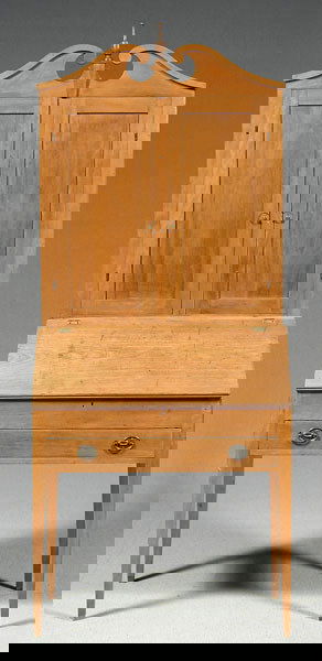 Cherry Hepplewhite desk and bookcase,: scrolled arch pediment above two frame-and-panel doors, interior with early possibly hand printed wallpaper, interior with three dovetailed drawers above 13 cubbyholes, base with tapered legs and dove