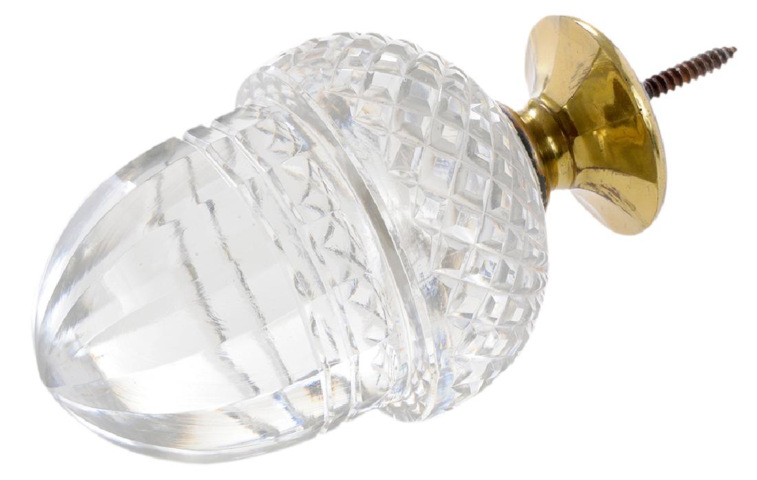Clear Cut Glass Acorn Newel Post Finial: British or Continental, late 19th century, finely cut in the form of an acorn mounted on a brass pedestal with inset screw, 8 in.. Provenance: Property from the Collection of Marjorie S. Fisher, Palm