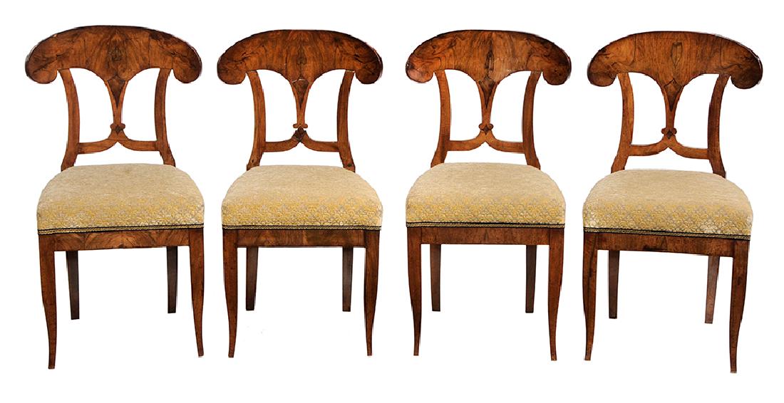 Four Biedermeier Inlaid and Upholstered Side Chairs: German or Austrian, 19th century, each with figured and book matched walnut veneers, voided velvet upholstery and finely tapered legs, 35 in.. Provenance: Property from the Collection of Marjorie S. F