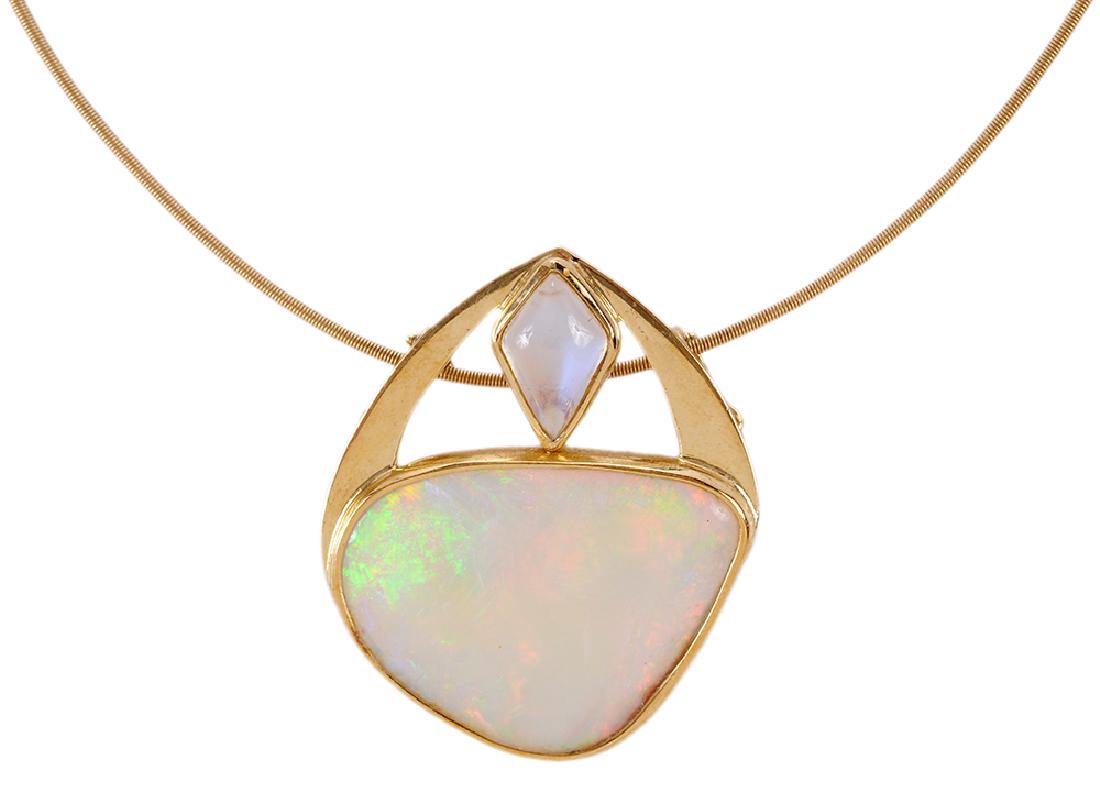 18kt. Opal & Moonstone Necklace: custom made pendant with one irregular shaped opal cabochon approx. 30.5 x 23mm, one kite shaped moonstone approx. 13 x 9mm, hand engraved "18K" and with signature, on neckwire stamped "AU, 750", 16 i