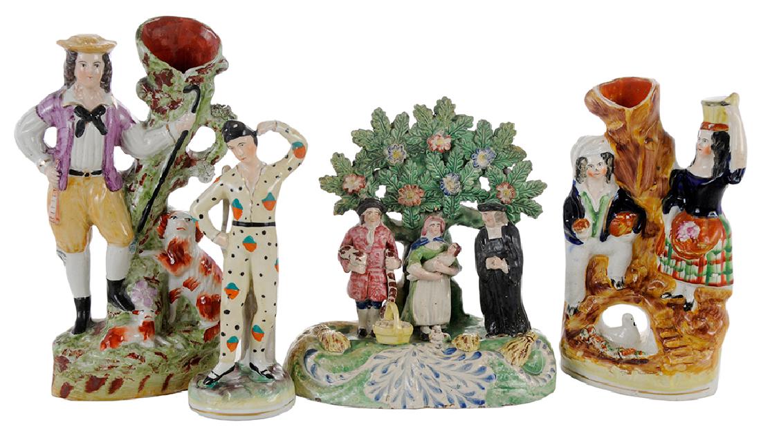 Four Staffordshire Figures and Vases: English, 19th/20th century, early vintage Tithe Pig group with floral tree bocage, 7-1/2 in., [extensive areas of restoration overall]; a double figural spill vase, squire with dogs, 9 1/2 in., [old b