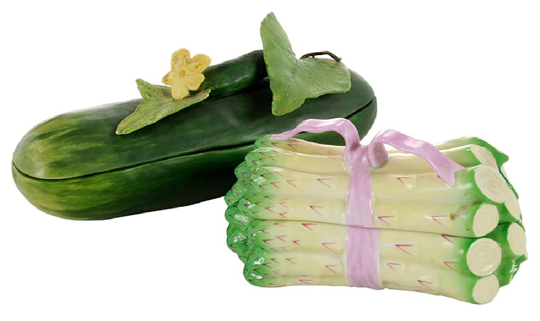 Two Vegetable Boxes: Herend asparagus with pink bow, 3-1/4 in.; and Mary Kirk Kelly cucumber, signed "Mary Kirk Kelly/No 19", 3-1/2 in. x 8-1/4 in.,. Provenance: Estate of June Montague Ficklen, Greenville, North Carolina