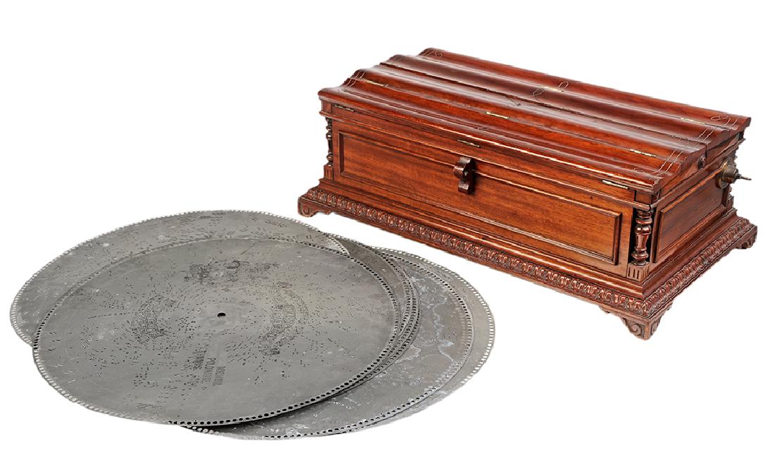 Regina #6 Mahogany Coffin Box: American, late 19th century, 27-inch Musical Box, No 21113 with brass bed plate, duel combs flanking the star-wheel arm, sugar-twist pressure bar, scalloped-shaped hinged lid above turned corner colum