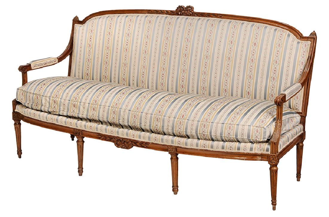 Provincial Louis XVI Style Beechwood Upholstered Sofa: French, 19th century, carved frame with pinned construction, modern silk upholstery with loose down cushion, 41 x 74 x 26 in.. Provenance: Property of a Georgia Private Collection