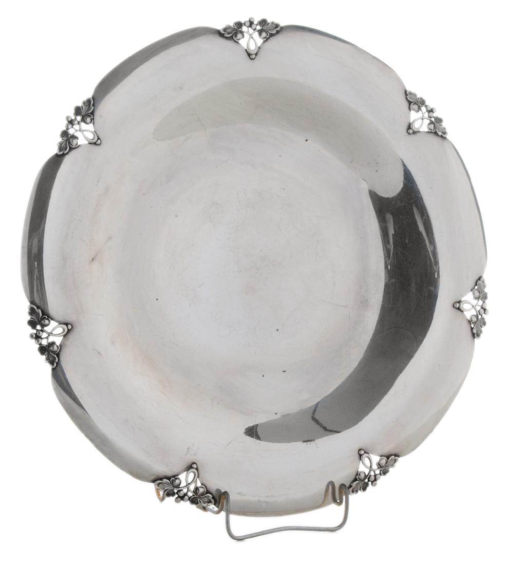 Fisher Alexandria Sterling Platter: American, 20th century, round with leaf and berry decoration, marks for Fisher, "2664", monogram on back "J. A. G. - E. M. H/June 30, 1951", 27.20 oz. T., 14-1/4 in.,. Provenance: Private Collection