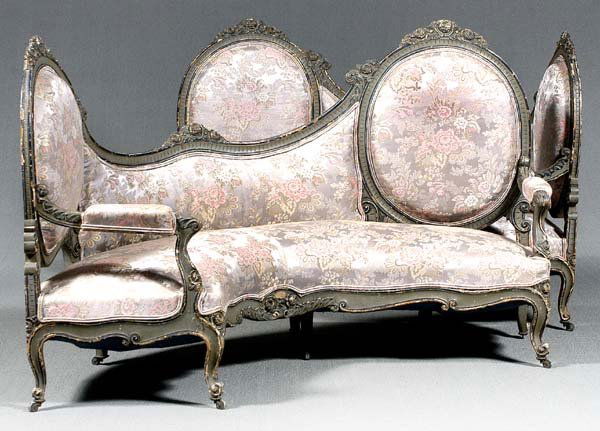 Pair Louis XV style settees: open arms with carved and painted floral decoration, carved skirts and cabriole legs with scroll feet, blue and gray painted frames over earlier gilt, finely upholstered in gray and rose damask, blue