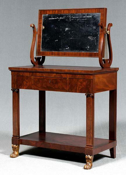 Duncan Phyfe classical dressing table,: rectangular swiveling mirror on lyre-form supports over three drawers and lower shelf, all with highly figured mahogany veneers, gilt paw-form front feet, New York, early 19th century, possibly shop o