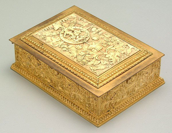 Bronze dore and ivory humidor,: elaborate Renaissance bronze dore frieze decoration, lid with similar finely carved ivory panel with figures on horses, animals, urns and angels, inside marked "JE Caldwell & Co., Inc., New York," 2-1