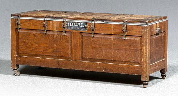 "Ideal" oak lift-top cooker,: three fitted lift-top compartments with six pans and seven heating stones, decal on front "Ideal Manufactured by the Toledo Cooker Company, Toledo, Ohio" with original brochure, early 20th century, 18
