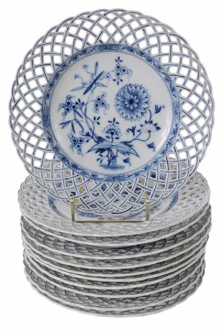 11 KPM Blue Onion Reticulated Plates: German, 20th century, plates with cobalt blue floral and foliate central decoration, wide reticulated rims with blue details, each with KPM sword mark, 9 in.
