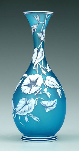Three-color cameo glass vase,: Three-color cameo glass vase, tapered trumpet neck and rim, white and pale red over blue, morning glories with moths, attributed to Thomas Webb, England, 1885-1925, 12 in. Provenance: Agnes Koehn Anti
