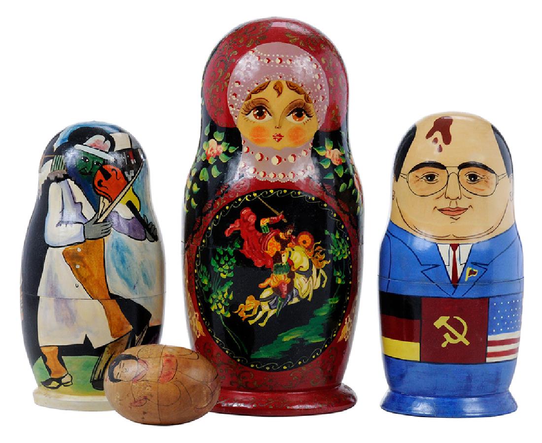 Four Wooden Nesting Dolls: Russian/Japanese, 20th century, Gorbachev nesting doll hand painted, 7 in., stable crack at base;
