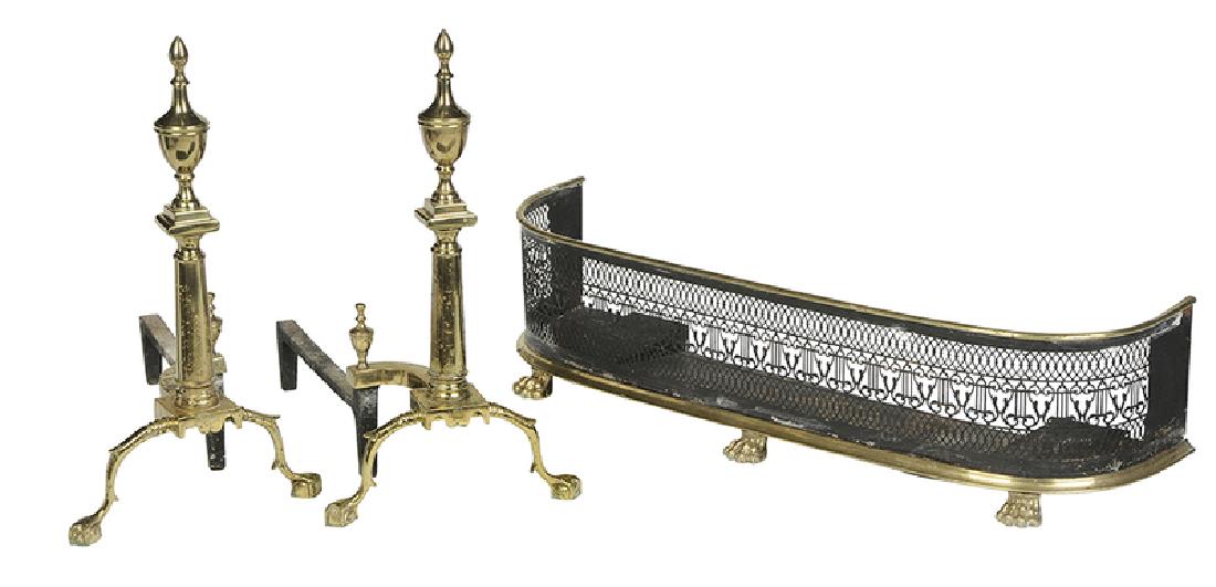 Pair Chippendale Style Andirons, Pierced Fender: 19th/20th century, urn top andirons with log stops, 24-1/2 in. [finish spotting and surface distress throughout], together with 19th century pierced brass fender, brass paw feet, black painted surface