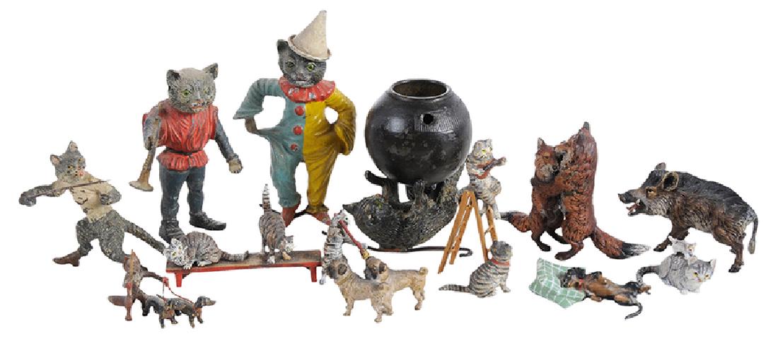 12 Minaiture Cold Painted Bronze Animal Figures: Continental, 19th/20th century, two cat nodders, one with bugle and one wearing jester costume, 3-1/2 in. and 4-1/4 in., scattered losses to paint; wild boar, marked "B" within a vase and "Austria", 1