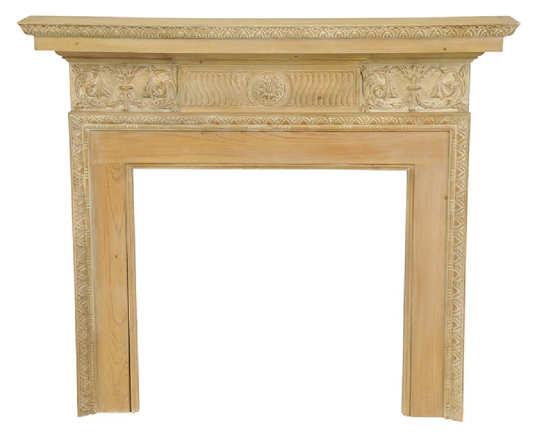 Chippendale Style Carved Fireplace Surround: 20th century, with carved moldings and frieze in pickled pine, 52-1/2 x 61 x 9 in.