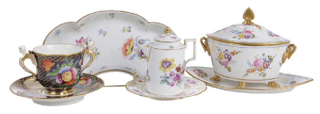 Five Pieces of Porcelain with Floral Decoration: Continental, 19th century, finely decorated floral cup with winged caryatid handles and matching saucer, with old tag from Rudolph Sparks Atlanta attributing cup to Spode circa 1810, 4 in. x 6-1/4 in.