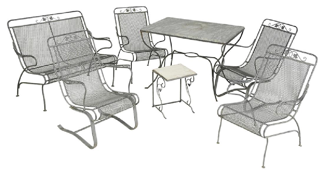 Seven Piece Set Garden Furniture: 20th century, comprising an acorn and oak leaf decorated table set with gray marble top, together with bench and four matching arm chairs in gray paint, with associated marble top side table, chairs 3