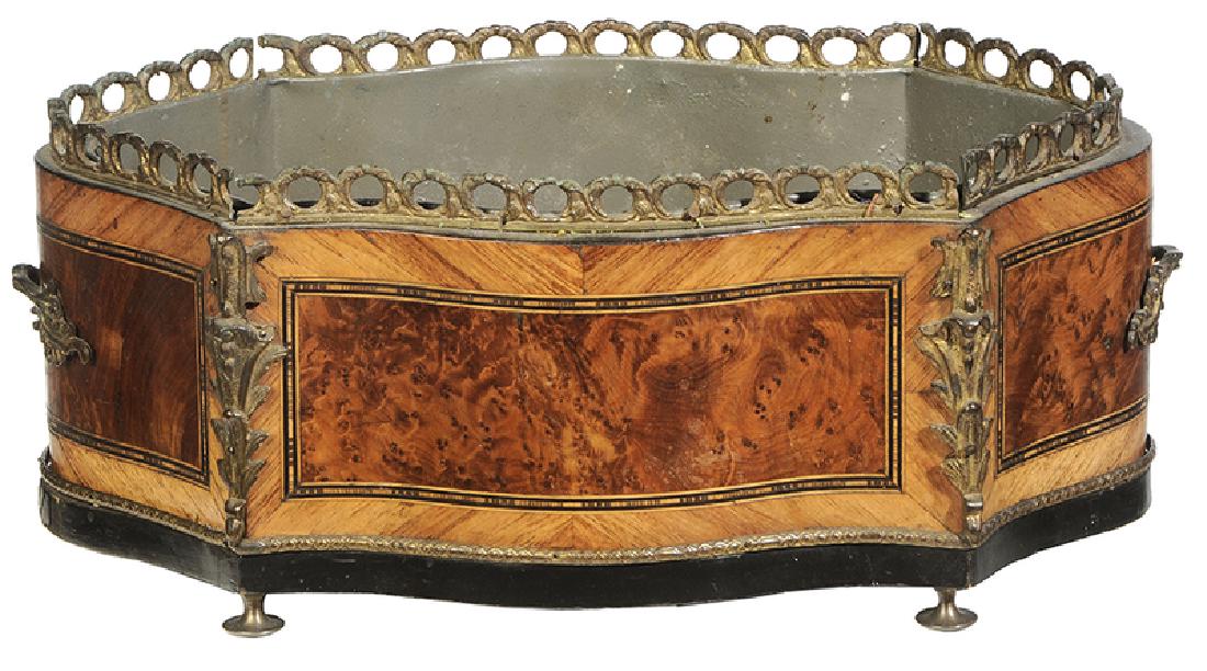 French Burlwood Jardiniere: 19th century, table top jardiniere with burled veneer panels, serpentine form with ebonized base, gilt bronze mounts on corners, gilt bronze handles and gallery on rim, metal liner, resting on four 