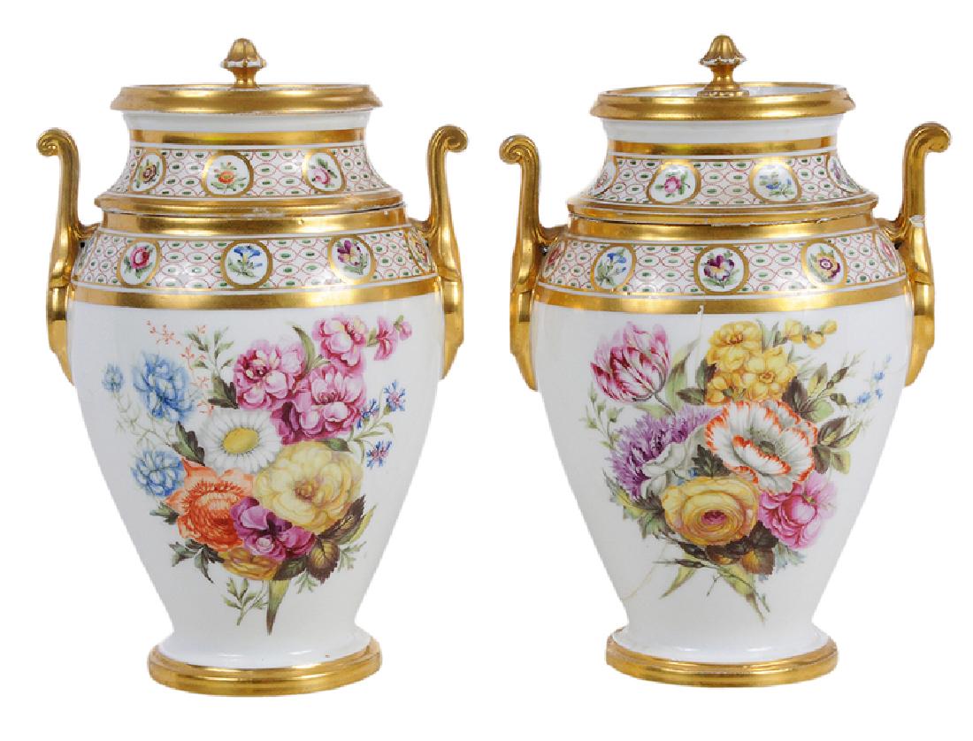 Pair of Meissen Fruit Coolers: German, 19th century, pair with tall tapering bodies, applied scrolling gilt handles, covers with deep wells and gilt finial shaped handles, expertly painted with floral bouquets front and back, Meiss