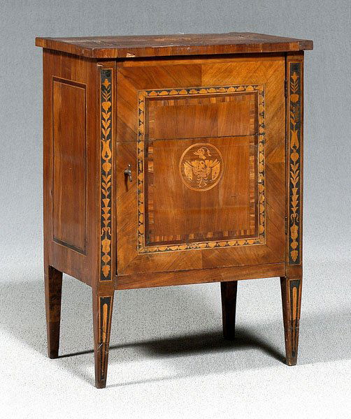 Italian neoclassical inlaid cabinet,: single cabinet door opening to paper-lined interior, top and door inlaid with coat of arms and banded surrounds, front stiles with flower and leaf inlay, tapered square legs, late 18th/early 19th cent