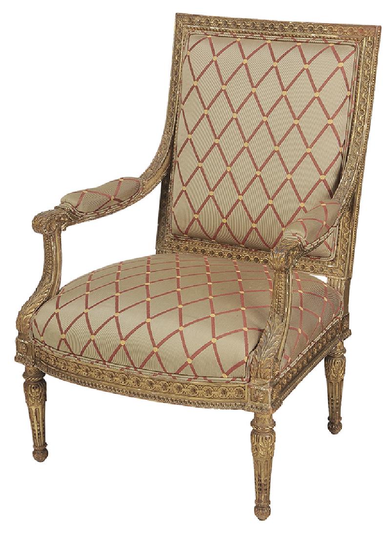 Louis XVI-Style Carved and Gilt Wood Arm Chair: French, 19th century; open arm, well-carved, gessoed, and gilt frame set with modern upholstery, 41 x 28 x 24 in.