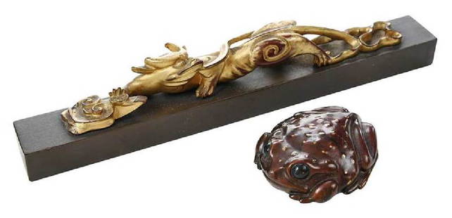 Chinese Paper Weight and Bronze Belt Buckle: Chinese/American, 19th/20th century, gold painted lacquered dragon figure on painted black base, 8-3/4 in.; Steve Kestrel, (American, b. 1948), patinated with painted accents figure of a frog, signed