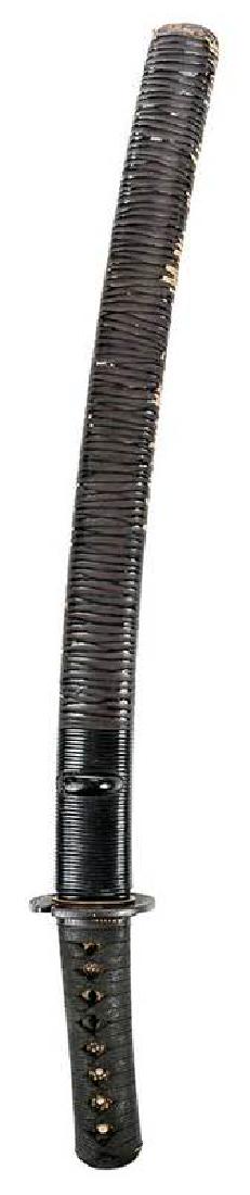 Edo Period Shobu-Zukuri Wakizashi Sword: 17th century, cloth wrapped handle with samegawa tsuka with menuki, tsuba, fuchi with inlaid mixed metal, top of blade signed Kanda Ju Kanetsune, lacquer scabbard, 21-1/2 in.