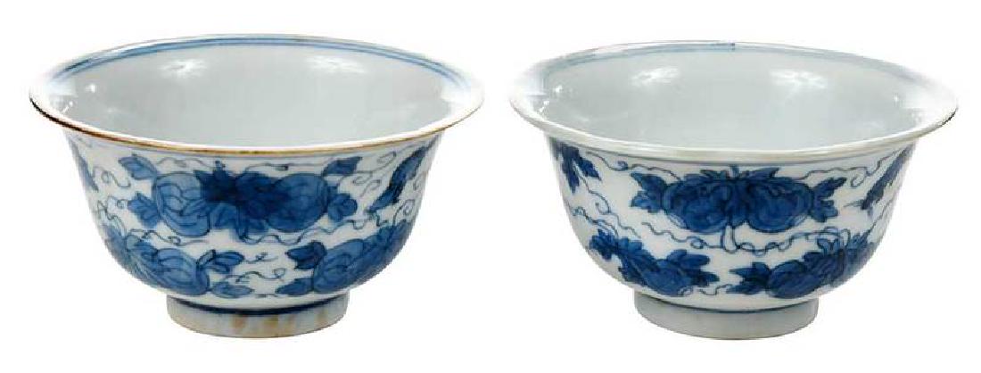 Pair 17th Century Blue and White Small Bowls: Chinese, transitional period, ring foot, flared rim, decorated in under glaze blue with squirrels and fruit, each with apocryphal Chenghua six character reign mark, 1-7/8 x 2-3/4 in.