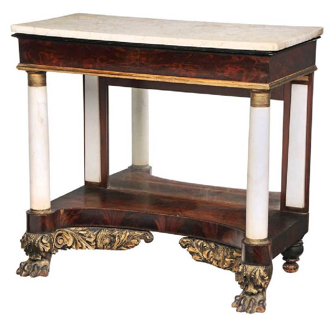 American Classical Marble Top Pier Table: New York, circa 1820s, gilt and ebonized boldly carved feet and returns, white marble top and columns, mirror plate, 36 x 39 x 20 in.