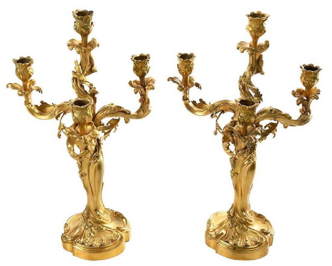 Pair Louis XV Style Ormolu Candelabra: French, late 19th century, cast by Susse Freres from a model by E. Lelievre, baluster shaped stem with one central and three scrolling branches terminating with floral candle cups, base signed "E. Lel