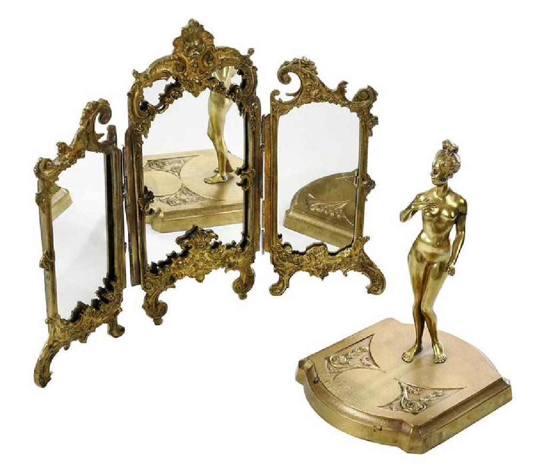Franz Bergman Gilt Bronze Nude with Mirror: (Austrian, 1861-1926) female nude with upswept hair standing on relief decorated base, signed "Nam Greg", 9-1/2 in., losses to gilt on figure's shoulder, arm cheek and foot, a few spots of gilt loss o