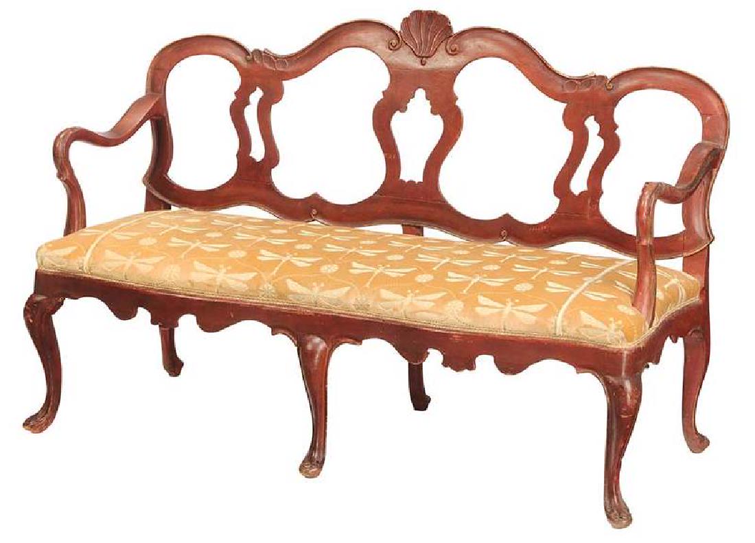 An Antique Venetian Carved and Painted Settee: Italian, 18th/19th century, carved frame with shell back and scalloped skirt, brick red paint with traces of gilding, modern dragonfly upholstery, 36 x 55 x 22 in. 