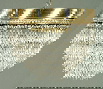 Seven-tier glass and brass chandelier,: circular brass frame with descending concentric tiers of prisms, some prisms with small chips, one prism missing, 15 x 18"