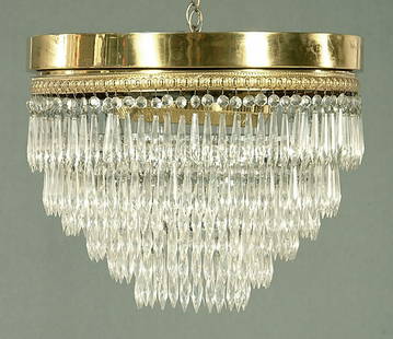 Seven-tier glass and brass chandelier,: circular brass frame with descending concentric tiers of prisms, some prisms with small chips, one prism missing, 15 x 18"