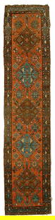 Persian runner,: five central medallions on pale salmon field, blue and brown borders, selvedge wear and losses with some rebinding, end loss, pile varies from none to low, 2'1" x 9'4"